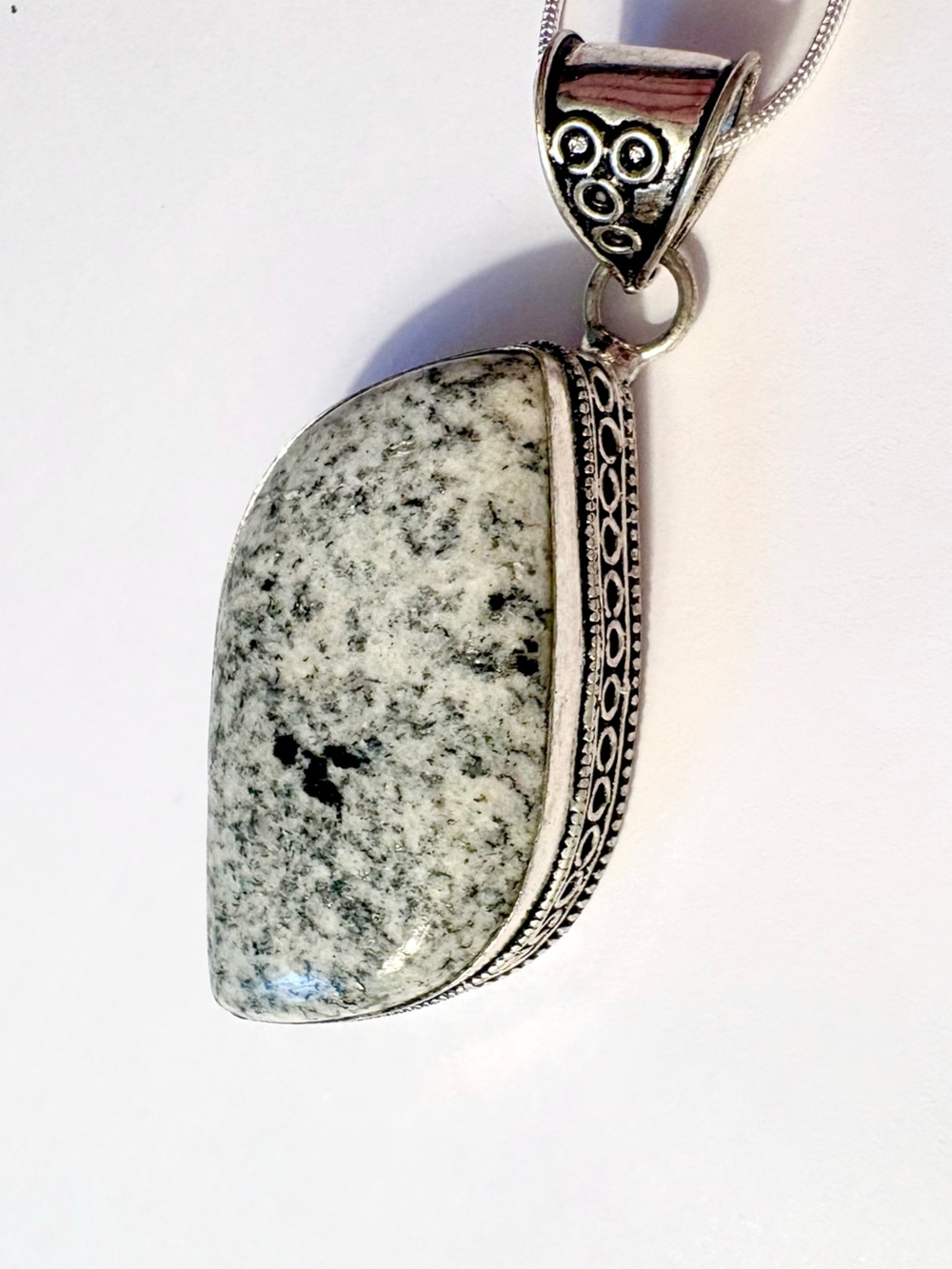 Large 2 1/2 inch, pendant with a 2 inch Japer Gemstone on a silver chain.